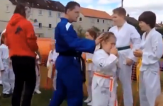 Taekwon-Do instructor kicks board into little girl's face