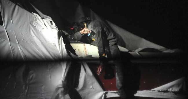 New images of the bloodied Boston Marathon bombing suspect's capture