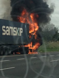 Driver escapes uninjured from large truck fire on M50