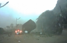 Giant boulder almost crushes car in dashcam video