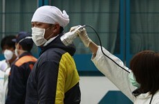 Fukushima workers pulled from reactor after smoke rises