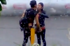 Man tries to keep his girlfriend nice and dry... fails horribly