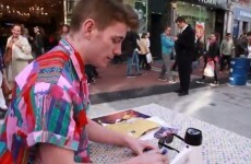 Random man signs autographs at Grafton Street stall