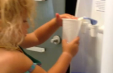 Little girl uses water cooler, doesn't quite get it right