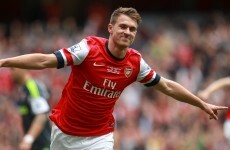 The newly prolific Aaron Ramsey scores as Arsenal go top