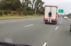 WATCH: Man hitches a ride down the M7 on the back of a truck