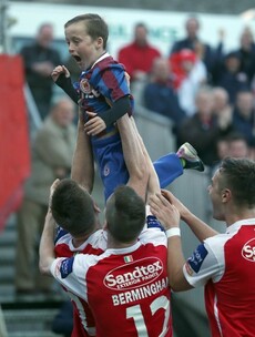 Snapshot: St Pat's players celebrate title-clinching goal with young supporter