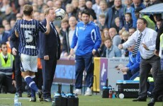 Harry Redknapp gets a ball in the face, gives Millwall official an ear-bashing