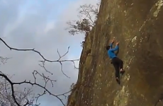 Free-climber plummets off rock face, dusts himself down and strolls away
