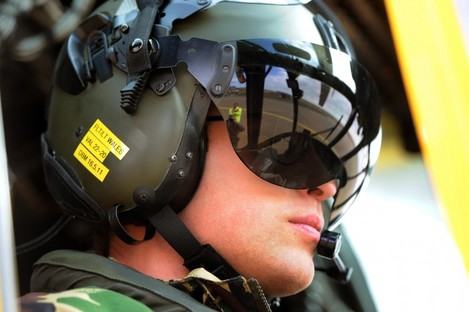 Prince William at the controls of a Sea King helicopter during a training exercise at Holyhead Mountain yesterday.