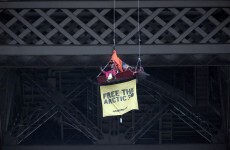 Greenpeace activist suspends from Eiffel Tower in protest