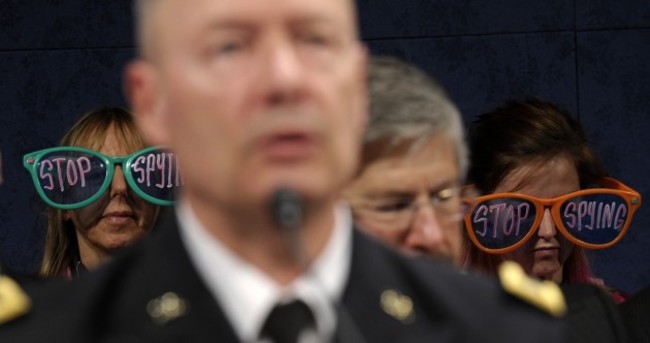 Photobomb protestors tell the NSA to 'stop spying'