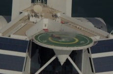 Why is David Coulthard doing doughnuts in an F1 car on a 700ft high heli-pad?