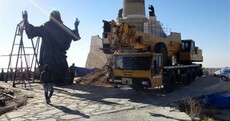 Armed groups hold their fire as giant bronze Jesus statue is erected on top of Syrian mountain