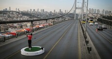 Tiger Woods hit a golf ball from Asia into Europe