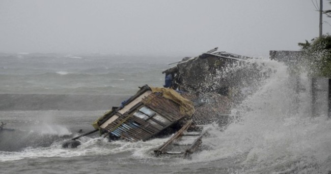 Powerful typhoon sweeps through Philippines, kills three and wrecks homes