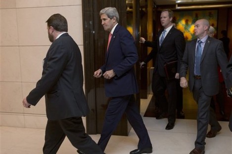 U.S. Secretary of State John Kerry, second left, arrives for a meeting with European Union's top diplomat Catherine Ashton. 