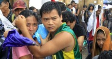 In Pictures: Survivors of Typhoon Haiyan attempt to leave Tacloban