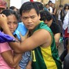 In Pictures: Survivors of Typhoon Haiyan attempt to leave Tacloban