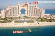 Pro golfers hit golf balls onto a floating green from the 22nd floor of a Dubai hotel