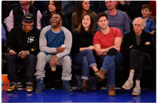 Larry David could not look any unhappier at having to attend NBA game