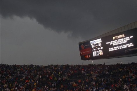 Fans are warned to take cover as a severe storm moves through Soldier Field during the first half of an NFL football game between the Chicago Bears and Baltimore Ravens.