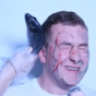 Dublin students sing Miley Cyrus while being slapped with a dead fish