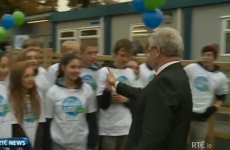 Watch Eamon Gilmore go in for a super awkward high-five (GIF)