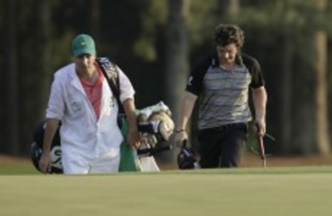 In the swing: McIlroy's caddy has many questions to answer
