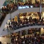 Man arrested for flinging money from 4th floor of shopping centre