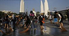 Thai anti-government protesters sweep streets ahead of king's birthday