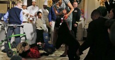 Sunny Obama takes down toddler at White House Christmas event