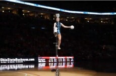 Watch this woman flip 5 bowls on her head in the ultimate balancing act