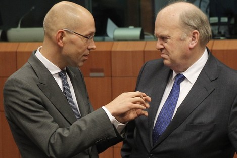 Finance Minister Michael Noonan speaks with Jorg Asmussen of the European Central Bank in Brussels last month