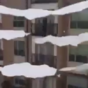 Thawing ice falling from apartment block is strangely satisfying