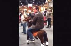Oh, just Arnold Schwarzenegger riding around on a toy horse