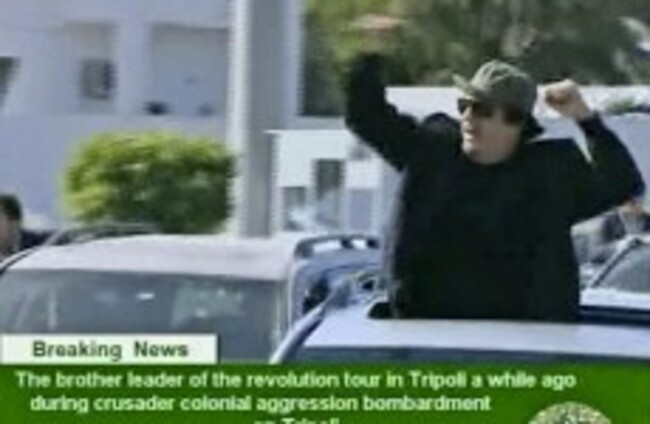 Government forces continue to pound Libyan city as US seeks refuge for Gaddafi