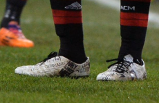 Mario Balotelli has headlines about him printed on his boots