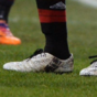 Mario Balotelli has headlines about him printed on his boots