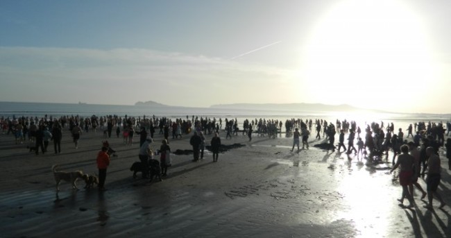 Pictures: Ireland celebrates Christmas (& clear skies) with icy dips, strolls on the strand