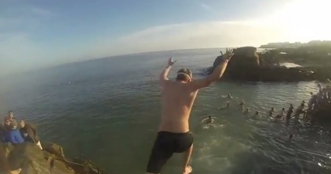 VIDEO: Christmas Day crowds queue up to leap into the icy waters at the 40 Foot