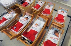 These babies wrapped in Christmas stockings are ludicrously cute