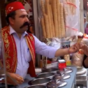 Ice cream vendor serves up some tricks with his cones
