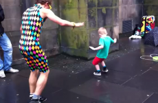 Small boy steals show from dancing street performer