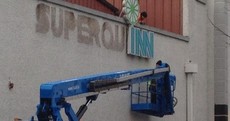 Pic: Superquinn sign is taken down to be replaced by SuperValu
