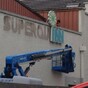 Pic: Superquinn sign is taken down to be replaced by SuperValu