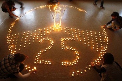 Pupils and teachers at a school in Minsk, Belarus, light candles in memory of the victims of the Chernobyl disaster in 1986.