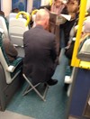 This man has a novel way of ensuring he has a seat on the train