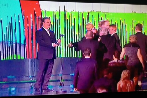 Chris Noth, aka Mr Big, waits to present the award to Brendan O'Carroll. 