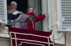 Peace doves released by the Pope are immediately attacked by a seagull and crow